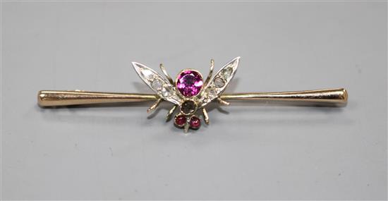 A Victorian 9ct, garnet and diamond set bug bar brooch, 54mm, gross weight 3.3 grams.